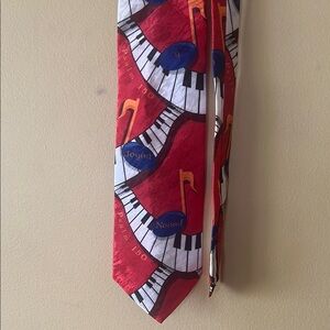 Dynamic Red and Orange Musical Tie
